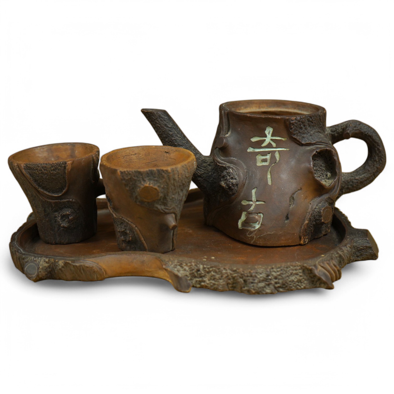 A Chinese naturalistic Yixing teapot, two cups and tray, early 20th century, 25cm high. Condition - fair/good